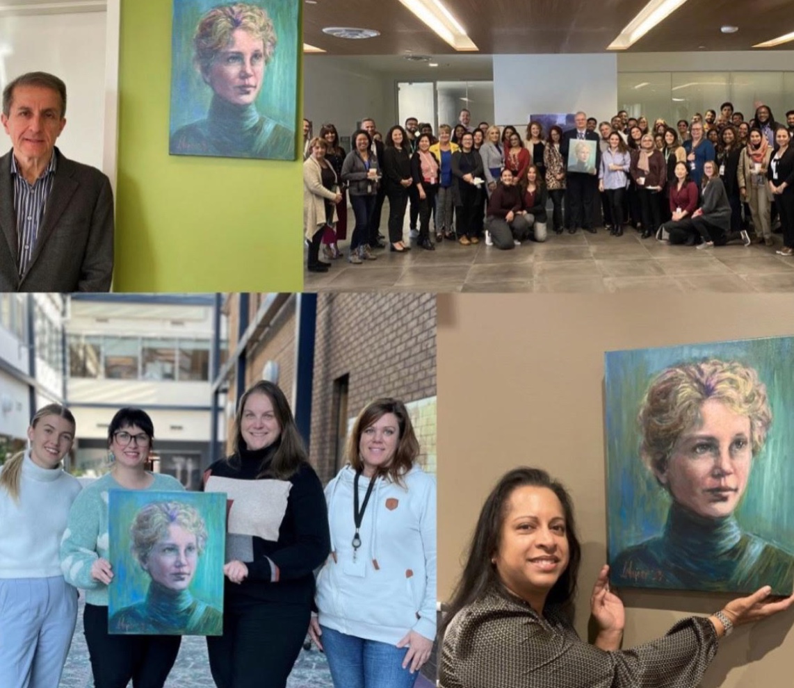 People viewing portraits of women scientists